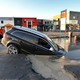Illustration for article titled New Christchurch earthquake swallows SUV